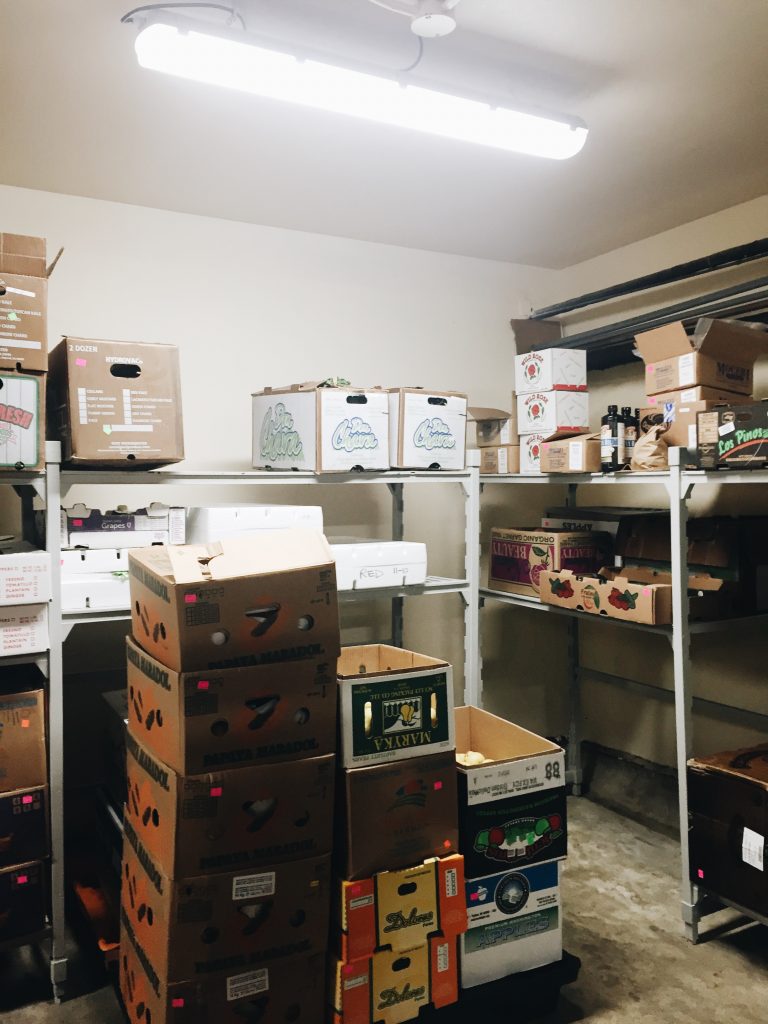 Wondering what all these fruit crates are for?  This is the refrigerator, where the fruits and vegetables are kept. The nutrition budget allows for almost $8,000 worth of fruits and vegetables to be purchased each week. 